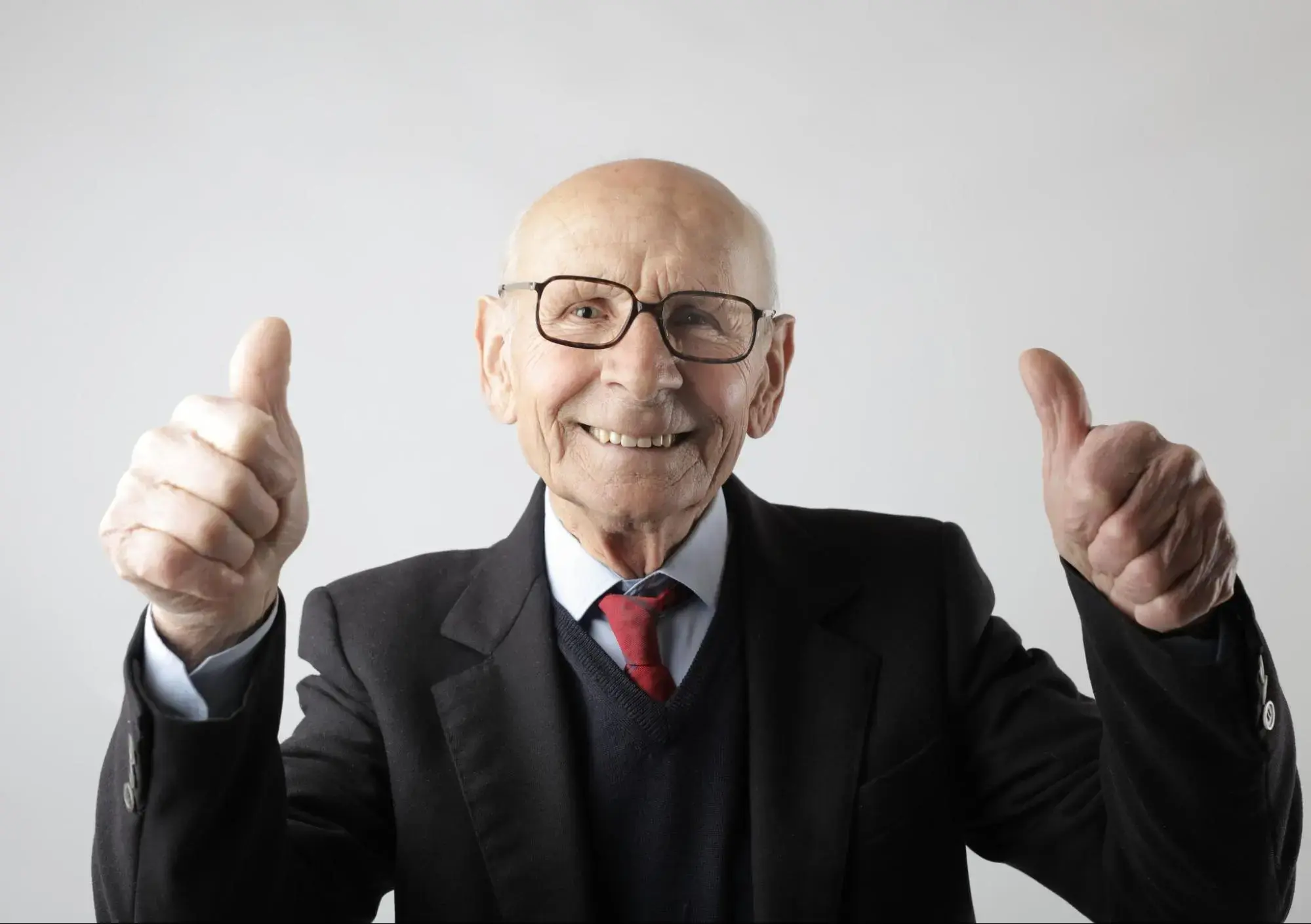 An old man who is happy because he has variable life insurance.