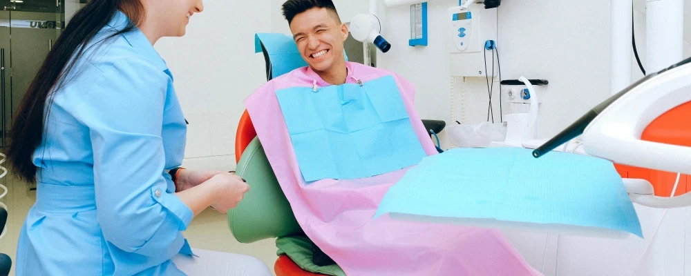 A person who is happy that they have Dental Insurance.