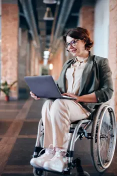 A woman in a wheelchair who is signing up for Term Life Insurance.