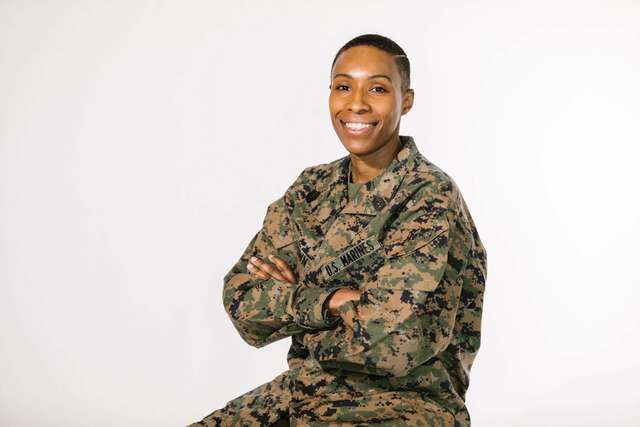 Source: https://www.pexels.com/photo/photo-of-smiling-woman-in-green-and-brown-camouflage-military-uniform-7467963/