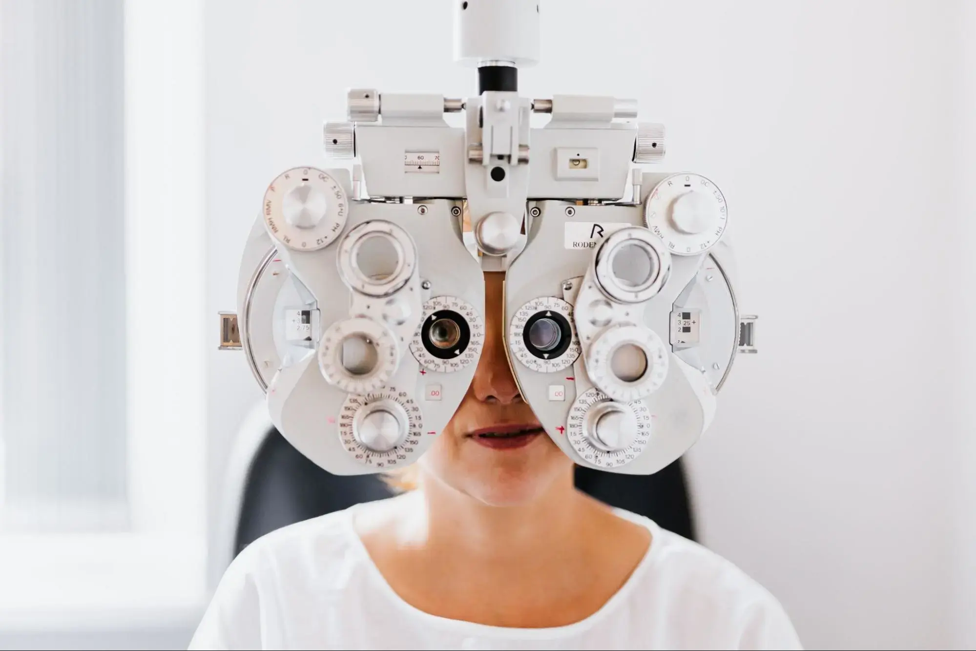 A woman getting her eyes tested.
