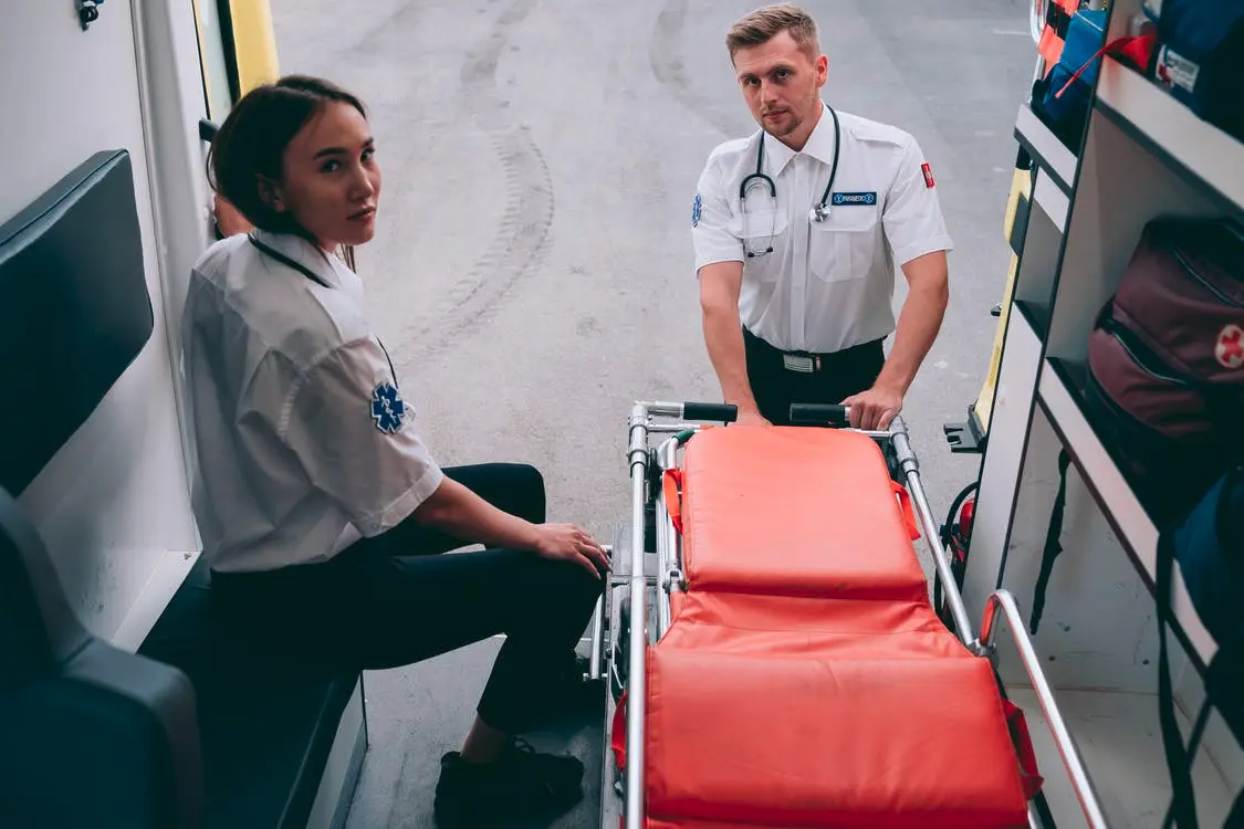 Paramedics in an ambulance which isn't covered by Medicare.