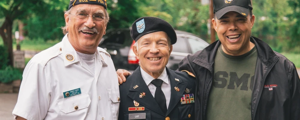 A group of veterans who are happy because they have Life Insurance.