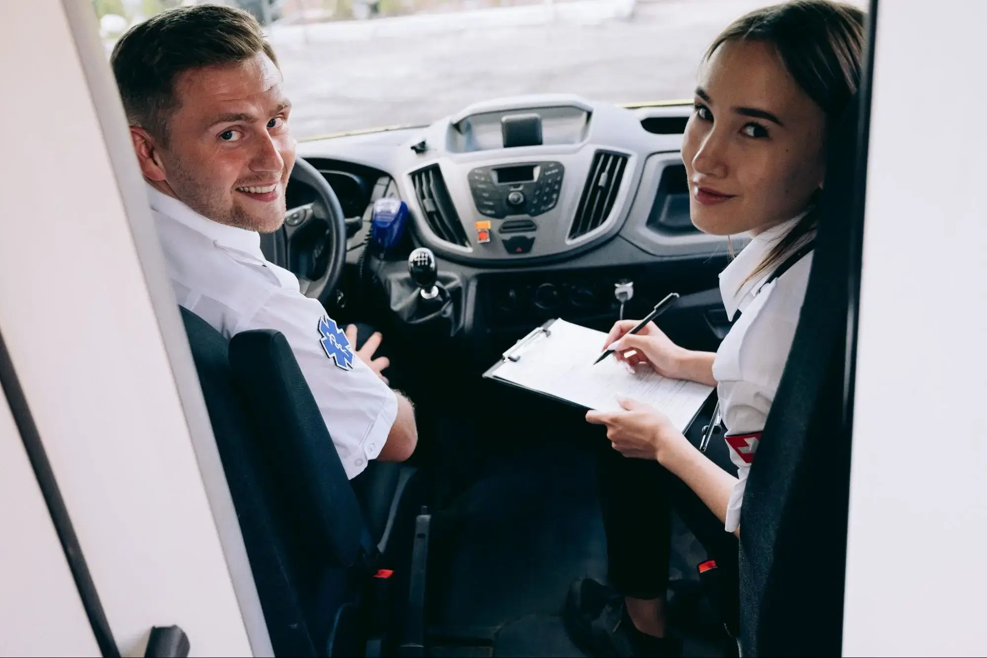 Healthcare Professionals in an Ambulance taking a patient to their medical appointment