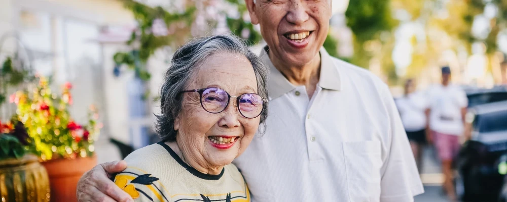 An elderly couple that is happy that their dermatology issues are covered by Medicare.