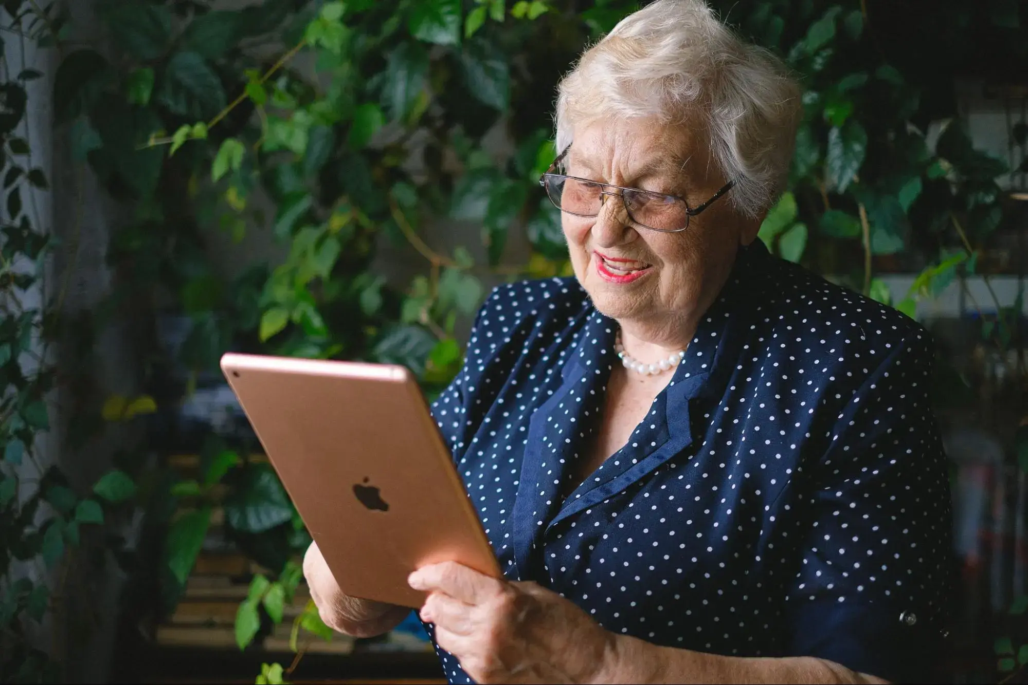 An elderly lady researching the Medicare PFFS plan costs.